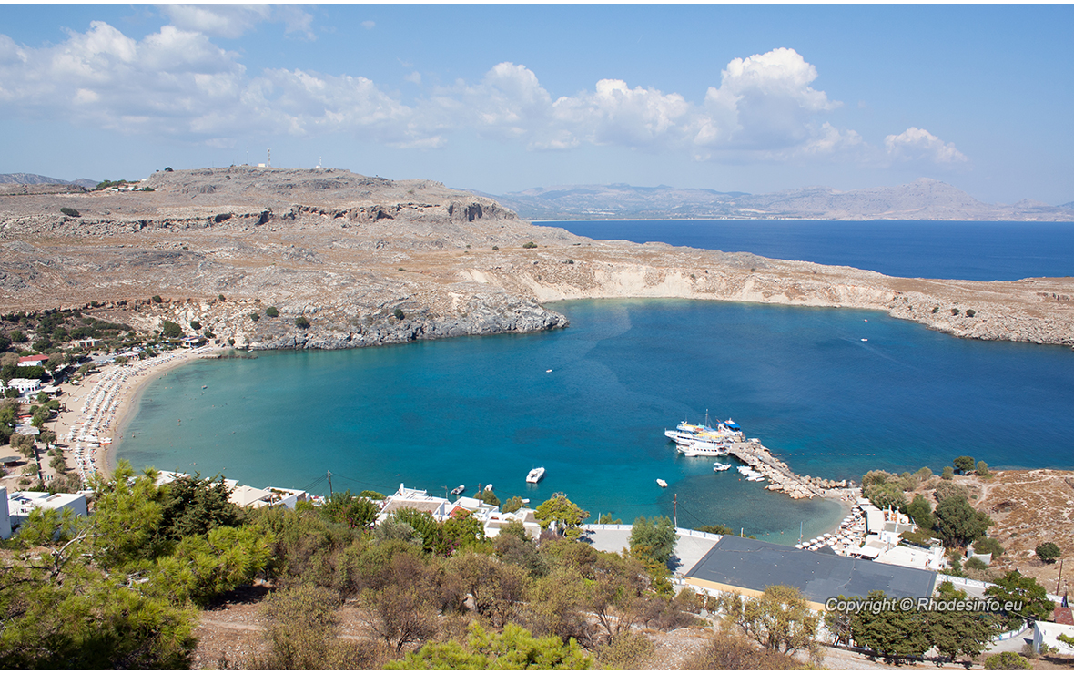 View from above of the main beach in Lindos, Rhodes, one of the Dodecanese Islands in the Aegean Sea, Greece.